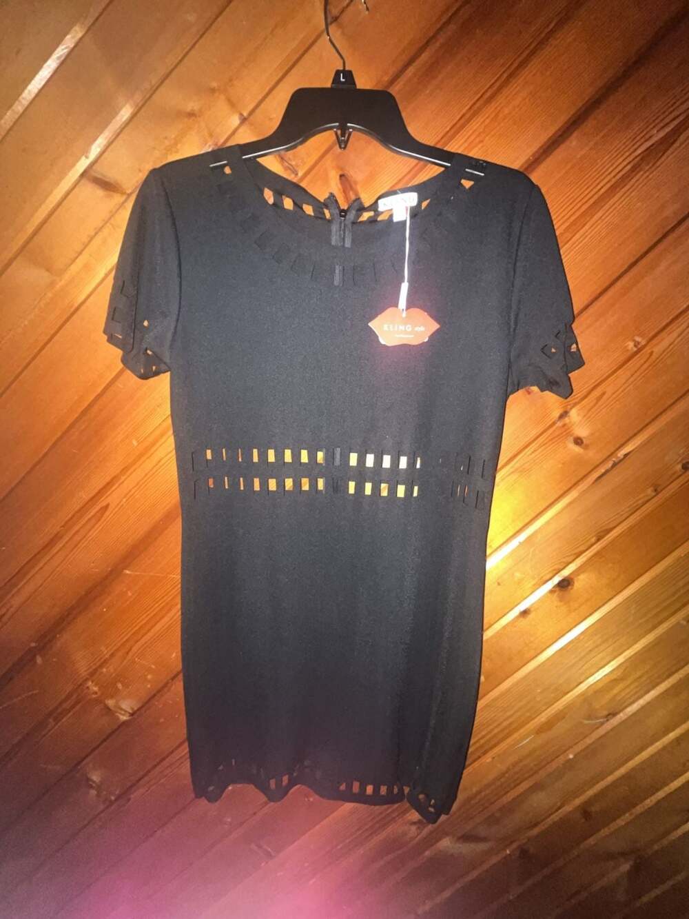 Kling Style Black Laser-Cut Mini Dress with Waist and Hem Detailing